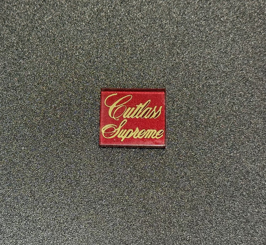 Oldsmobile Cutlass Supreme Trunk Lock Cover Insert Emblem Reproduction Red Metallic and Gold