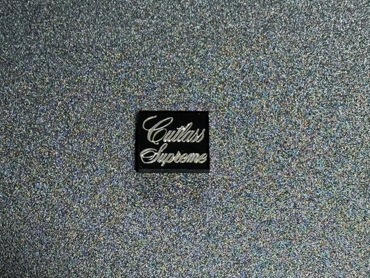 Oldsmobile Cutlass Supreme Trunk Lock Cover Insert Emblem Reproduction Black and Chrome